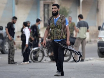 Rebeldes mayoritariamente suníes que buscan derrocar a Assad están luchando en las...