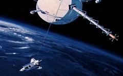 Concepto artístico de un satélite atado a un transbordador espacial.