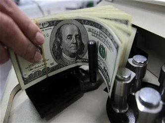 El Departamento de Comercio dijo que el déficit de cuenta corriente se amplió al...