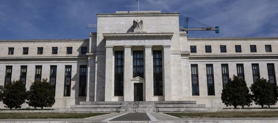 La Fed bajó sus tasas a un rango objetivo de 0% a 0,25% y dijo que ampliaría su hoja...